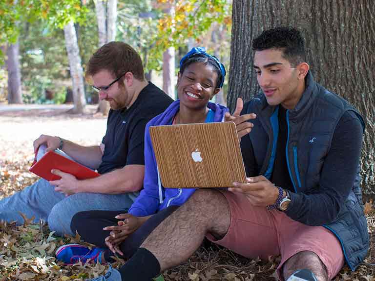 Students Looking at Calendar using Apple Computer